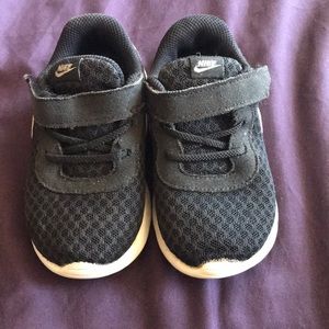 Black Nike kids shoes